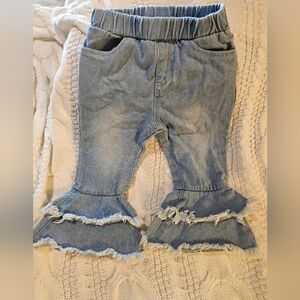 Adorable flare distressed jeans with ruffles for kids!